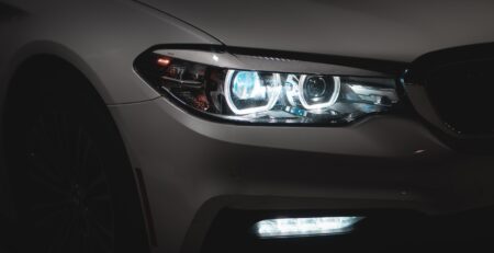 gray car with white and blue lights